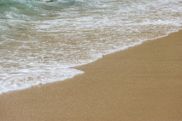 Natural splashing wave sea sand beach on sunny day at Phuket island.