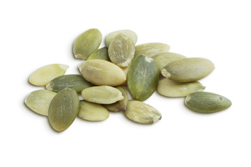 Pumpkin Seeds Kernels. Peeled Pampkin Seeds Isolated on White Background. Full Depth of Field 