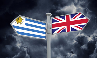 Uruguay and United Kingdom guidepost. Moving in different directions. 3D Rendering