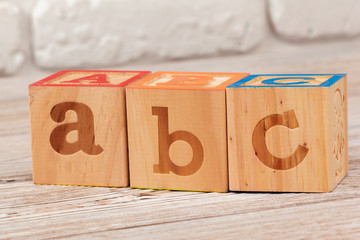 Wooden toy Blocks with the text: abc