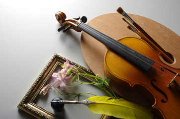 Fototapeta premium Violin, palette, brush, feather and inkwell.