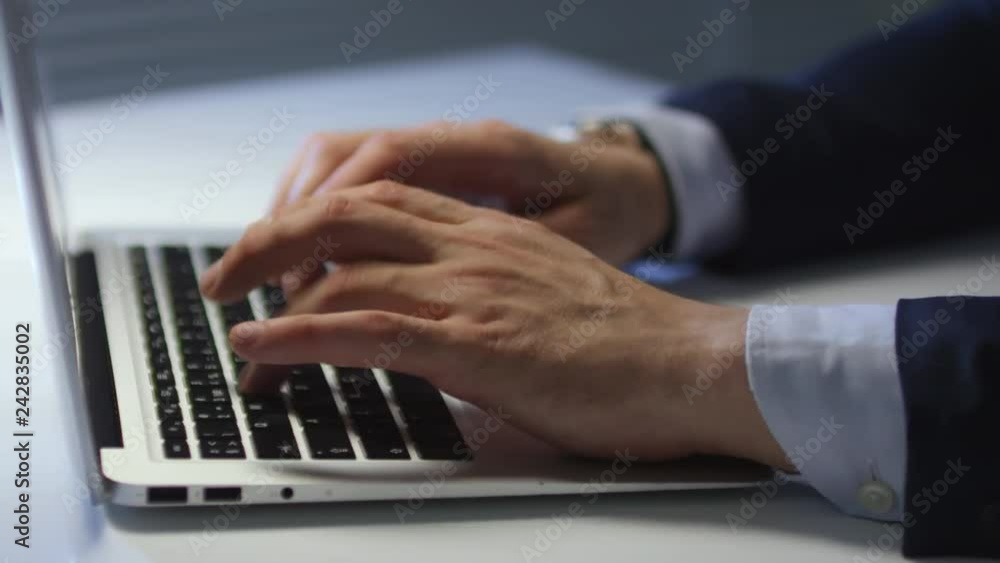 Poster tracking close up shot of hands of unrecognizable businessman in formal clothes sitting at office de