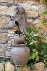 Waterfall decoration with clay jars