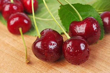 Ripe sweet cherry on a wooden table. Close-up