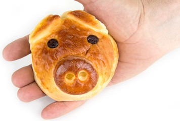 Bun with sweet stuffing in shape of pig head