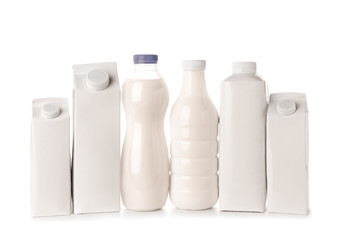 Different packs with milk on white background