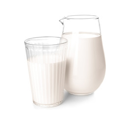 Jug and glass of fresh milk on white background