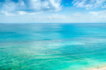 Fototapeta na wymiar Bali Luxury Resort, Coral Reef, Waves. Amazing Background in Crystal water. Top Island View in Blue Ocean in Paradise Beach. Beautiful Tropical Blue Sea Background. Aerial Paradise Island Beach View