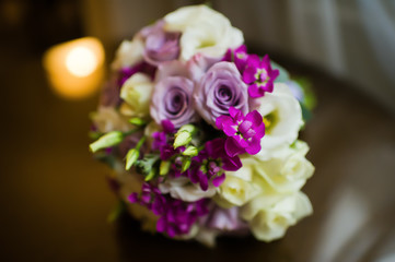 wedding bouquet of the bride, white and purple roses
