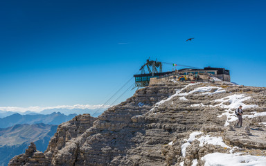 Fototapeta premium Cable car station on Pordoi Pass (2.240 m), leading to Sass Pordoi (2.950 m), Sella group, Dolomites, northern Italy, Europe
