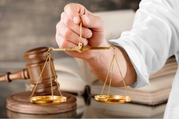 Weight scales in hand on white background