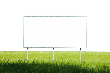 A blank advertising billboard immersed in a wheat field