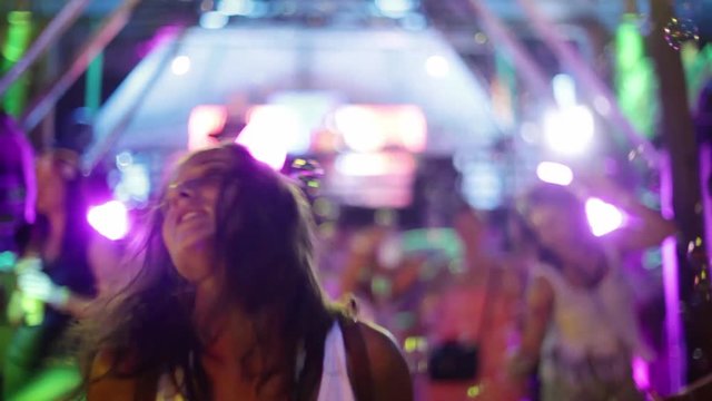 Beautiful girl is dancing in a night club. Disco. 1920x1080