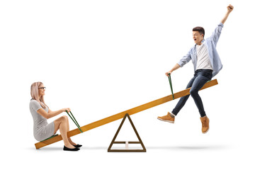 Young woman and a teenage boy on a seesaw