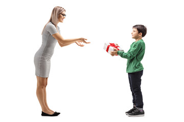 Young boy giving a present to his mother