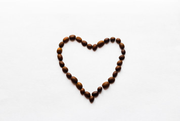 heart on a white background of coffee beans