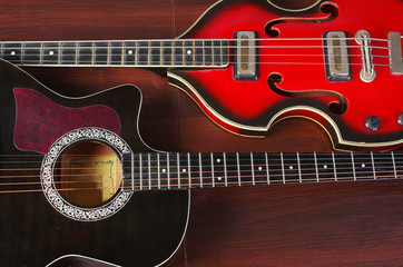 Obraz na płótnie Canvas Two electric guitars on a wooden table
