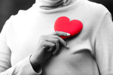 hands holding red heart, health care, donate and family insurance concept, world heart day