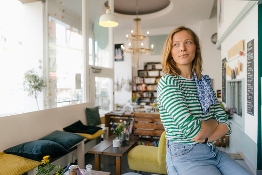 Young woman in a cafe looking sideways