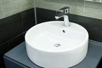 Bathroom interior with circle sink and faucet