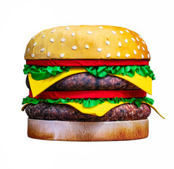 Big artificial burger isolated on white background.