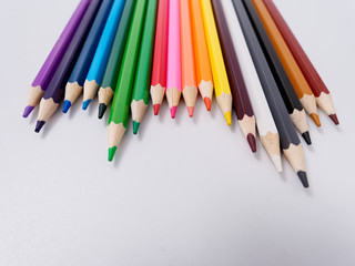 colored pencils sharpened on a white background.