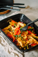 Meat with beans, corn, asparagus beans, sweet peppers, chili peppers and microgreen. Healthy food and diet concept, restaurant dish delivery. Take away of fitness meal. Weight loss nutrition in boxes.