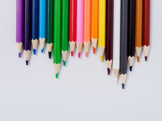 colored pencils sharpened on a white background.