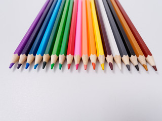 colored pencils sharpened on a white background.