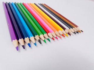 colored pencils sharpened on a white background.