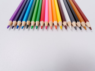 colored pencils sharpened on a white background.