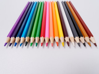 colored pencils sharpened on a white background.