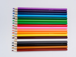 colored pencils sharpened on a white background.