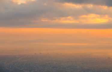 City view, orange light in the morning with fog