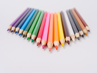 colored pencils sharpened on a white background.