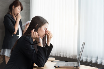 Two business woman work and using laptop computer ,study business ideas.serious in work.