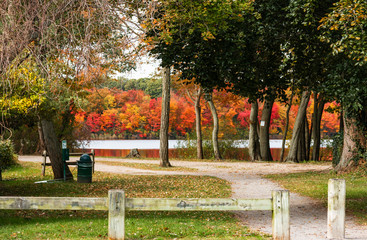 Entrance to park with autumn colored trees in background