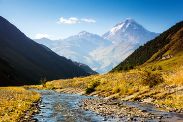 Captivating scene of the alpine valley in sunlight. Main Caucasus ridge.
