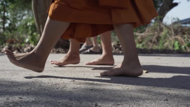 Close up to the footstep of monk walk without the shoe.