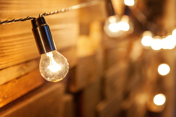 Modern dark classical style interior design apartment with retro lamps hanging light bulbs...