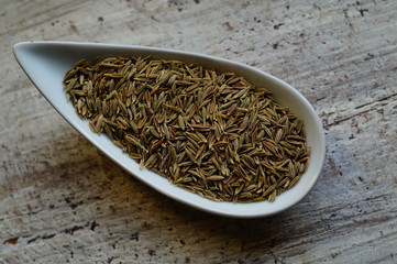 Fototapeta na wymiar Kmin Roman Whole Seeds - Roman Cumin for health - as a condiment for the dishes 