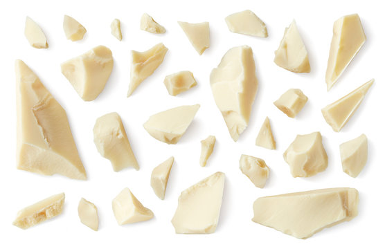 White broken chocolate pieces isolated on white background