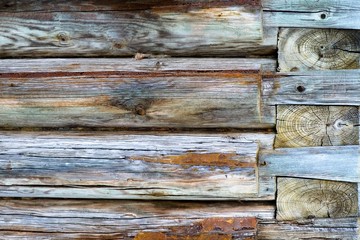 Fragment of a wooden log wall of the old Russian church as the basis of the background. 