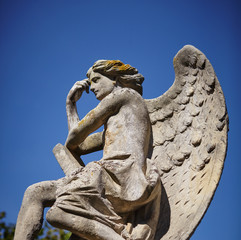 angel statue in sunlight as a symbol of strength, truth and faith
