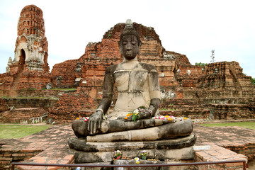 Buddha image in Wat Mahathat or The temple of the Great Relic in Ayutthaya Historical Park,...