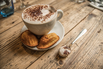 Fresh Cappuccino Coffee with foam on spoon