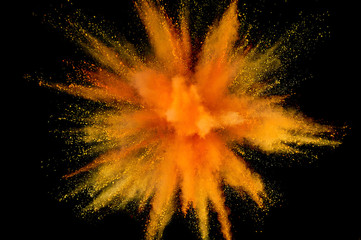 Colored powder explosion. Abstract closeup dust on backdrop. Colorful explode. Paint holi