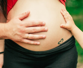 pregnant woman belly Outdoors closeup