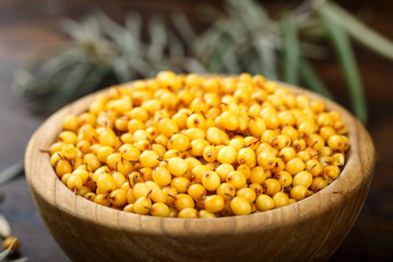 sea buckthorn berries on a wooden background