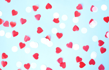 Valentine's day background on a blue background with hearts.